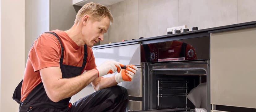 GetItDone fitter installing a kitchen appliance